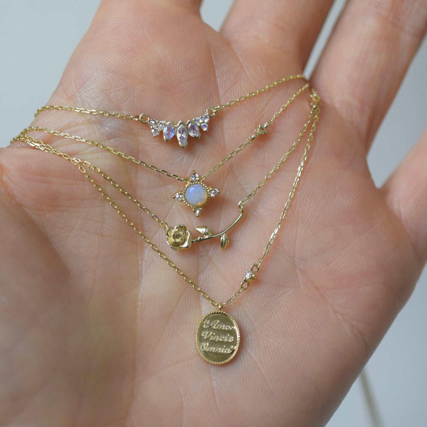 Solid Gold "Love Conquers All" Diamond Pendant