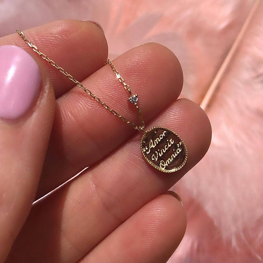 Solid Gold "Love Conquers All" Diamond Pendant